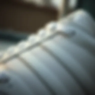 Detail of the iconic three stripes design on the Samba White