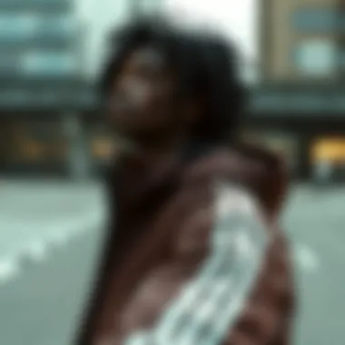 Model showcasing the adidas velvet jacket in an urban setting