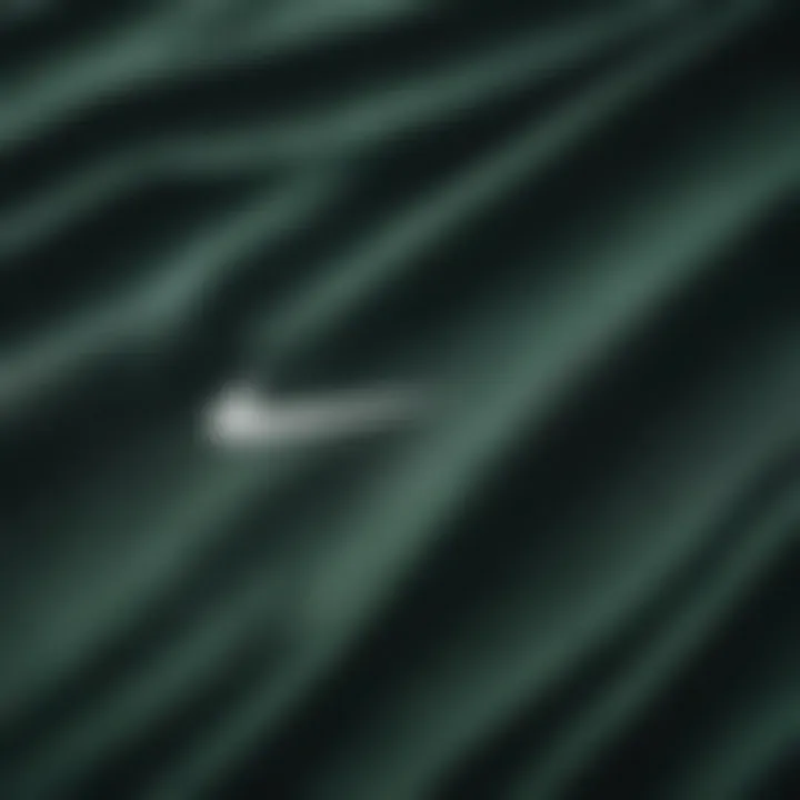 Close-up of the fabric texture of the dark green Nike shirt