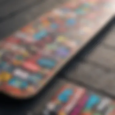 Close-up view of a skateboard deck covered in colorful anime-themed stickers