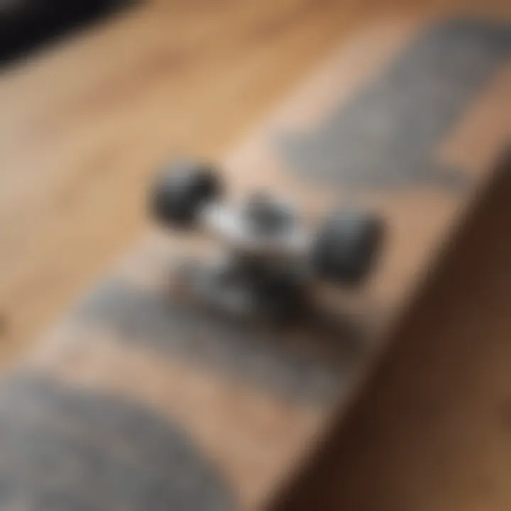 Close-up view of a skateboard deck adorned with artistic grip tape, highlighting texture and grip.