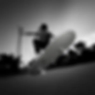 Skateboarder performing tricks in black and white Vans