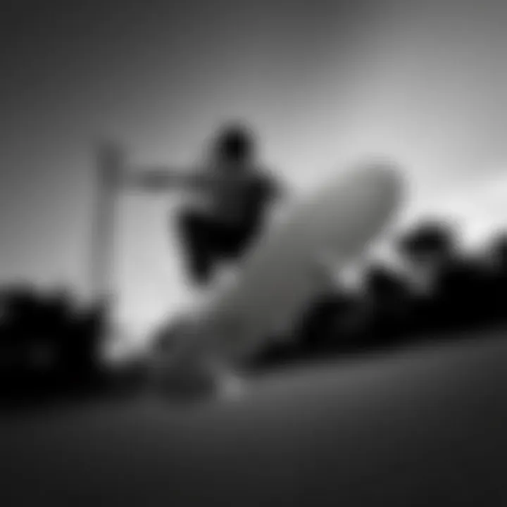 Skateboarder performing tricks in black and white Vans