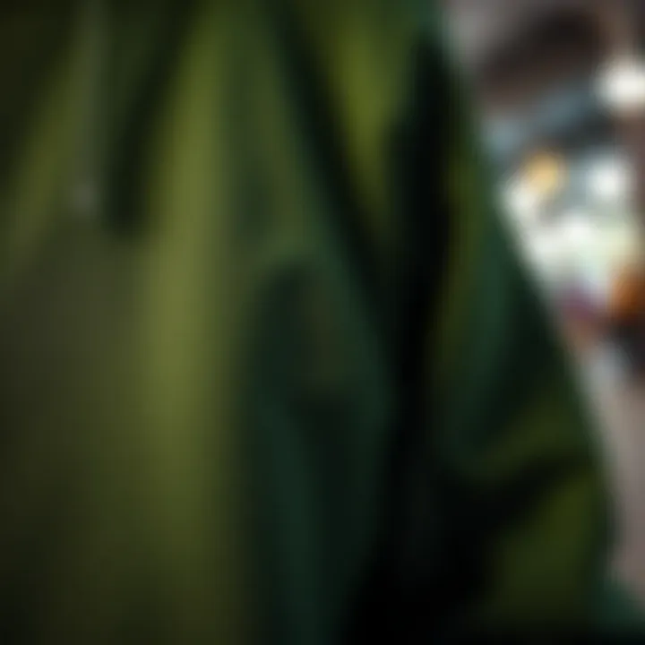 Artistry in Fabric: Design Elements of Green Sweatshirts Close-up of the fabric and design details of a green graphic sweatshirt