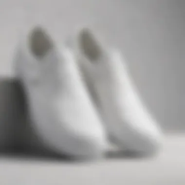 Close-up view of all white slip-ons showcasing texture and design