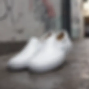 Variety of all white slip-ons displayed against a graffiti background