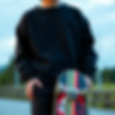Integration of Sweatshirt in Skate Culture A skateboard and black crew neck sweatshirt styled together
