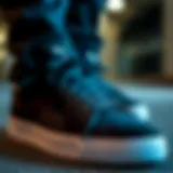 Close-up of black Puma suede shoes showcasing intricate design details