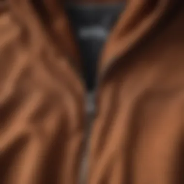 Close-up of fabric texture showcasing the quality of the brown zip up hoodie