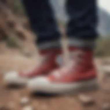 Stylish pair of Converse high tops on rocky terrain