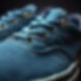 Detail of Denim Blue Vans A close-up of denim blue Vans showcasing intricate stitching and fabric texture