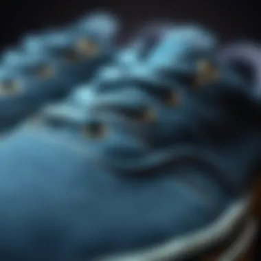 Detail of Denim Blue Vans A close-up of denim blue Vans showcasing intricate stitching and fabric texture