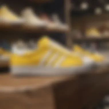 A collection of yellow and white shell toe Adidas shoes displayed in a skate shop.