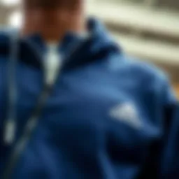 Close-up view of the zip detailing on the adidas sweatshirt highlighting craftsmanship