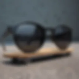 Stylish round black sunglasses resting on a skateboard