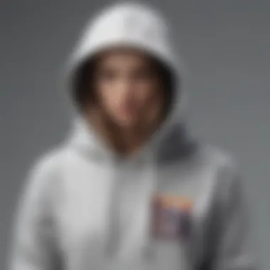 An artistic representation of a plain grey hoodie in a contemporary fashion context, symbolizing cultural significance.