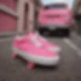 Vibrant pink Vans sneakers on a skateboard