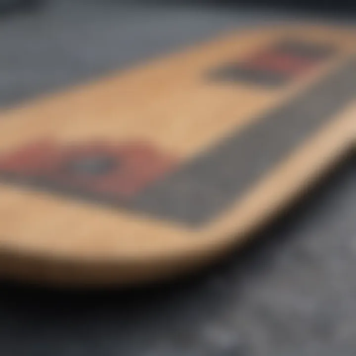 Close-up of a skateboard deck displaying width variations and grip tape texture.