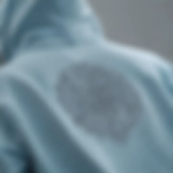 Close-up of a light blue hoodie with intricate design elements that reflect personal expression in skate culture.