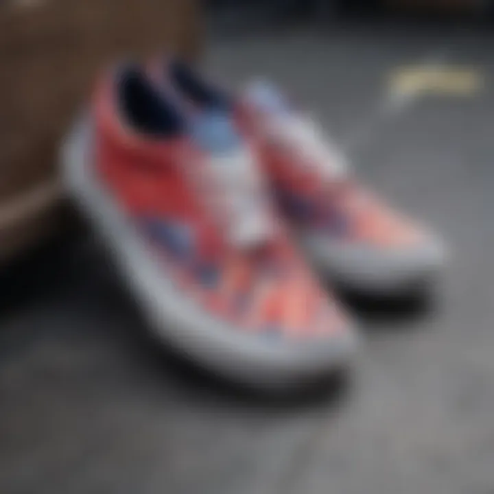 A pair of vibrant red and blue checkered Vans shoes on a skateboard