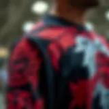 Intricate Black and Red Design A close-up of a black and red graphic shirt showcasing intricate designs