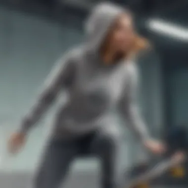 Female skateboarder wearing a grey hoodie while performing a trick