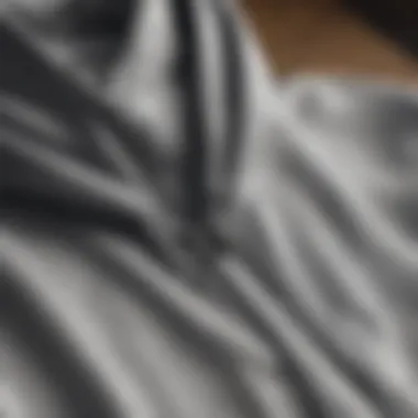 Fabric Focus: Short Sleeve Zip Hoodie Details Close-up of the fabric and stitching of a short sleeve zip hoodie.