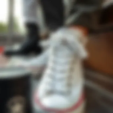 Showcasing maintenance routine for plain white Converse sneakers