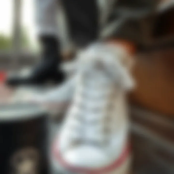 Showcasing maintenance routine for plain white Converse sneakers